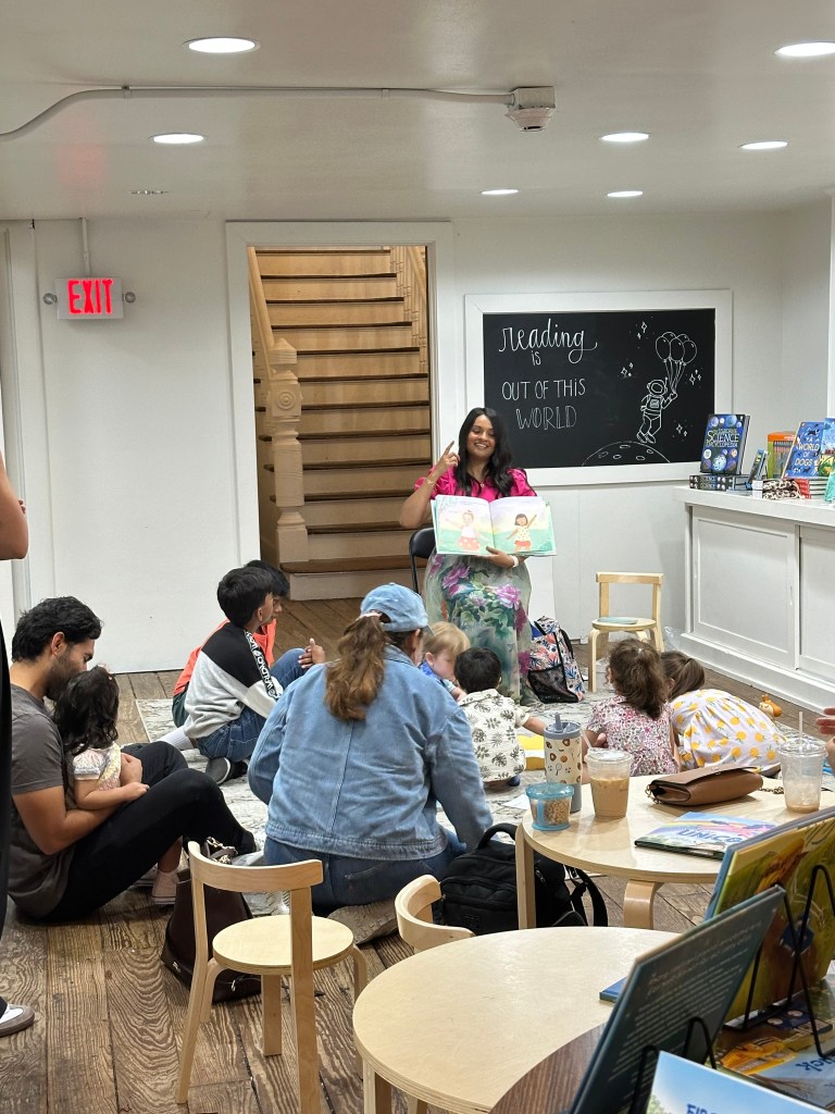Image of Natasha Khan Kazi reading to an audience at a bookstore.